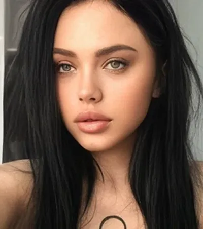 Dark-haired OnlyMonster creator in a close-up portrait